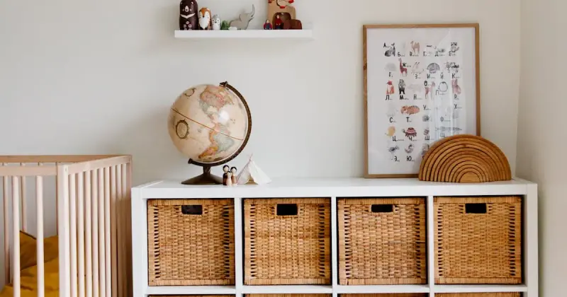 Bright and clean baby nursery with natural wood furniture