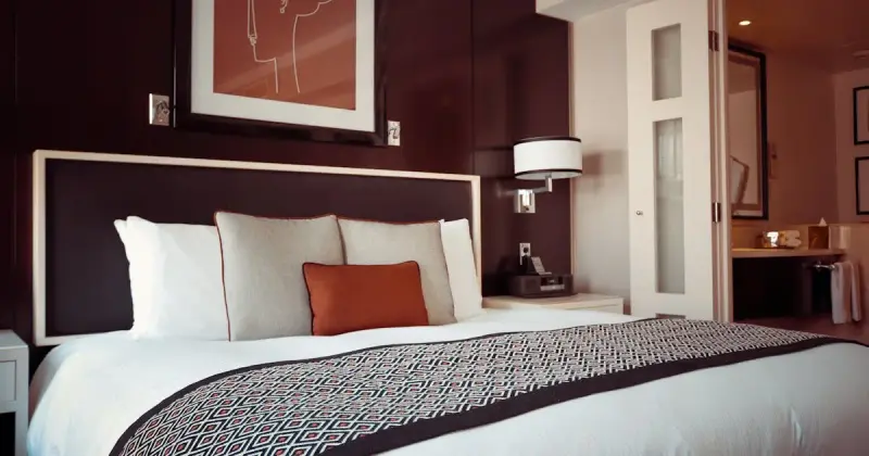 Hotel room with fresh linens and cleaned surfaces