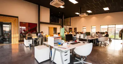 Modern office space with clean desks and organized workspace