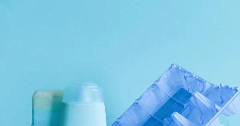 Person reading ingredient label on a cleaning product bottle