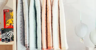 Various bathroom accessories and towels organized on shelves