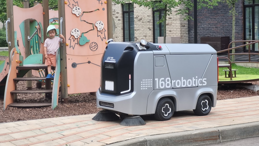 Robot cleaning street near playground