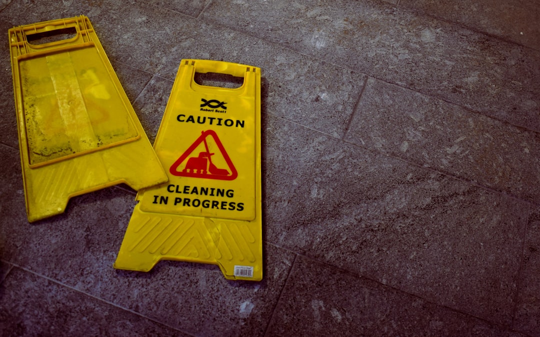 Yellow caution sign cleaning in progress on floor
