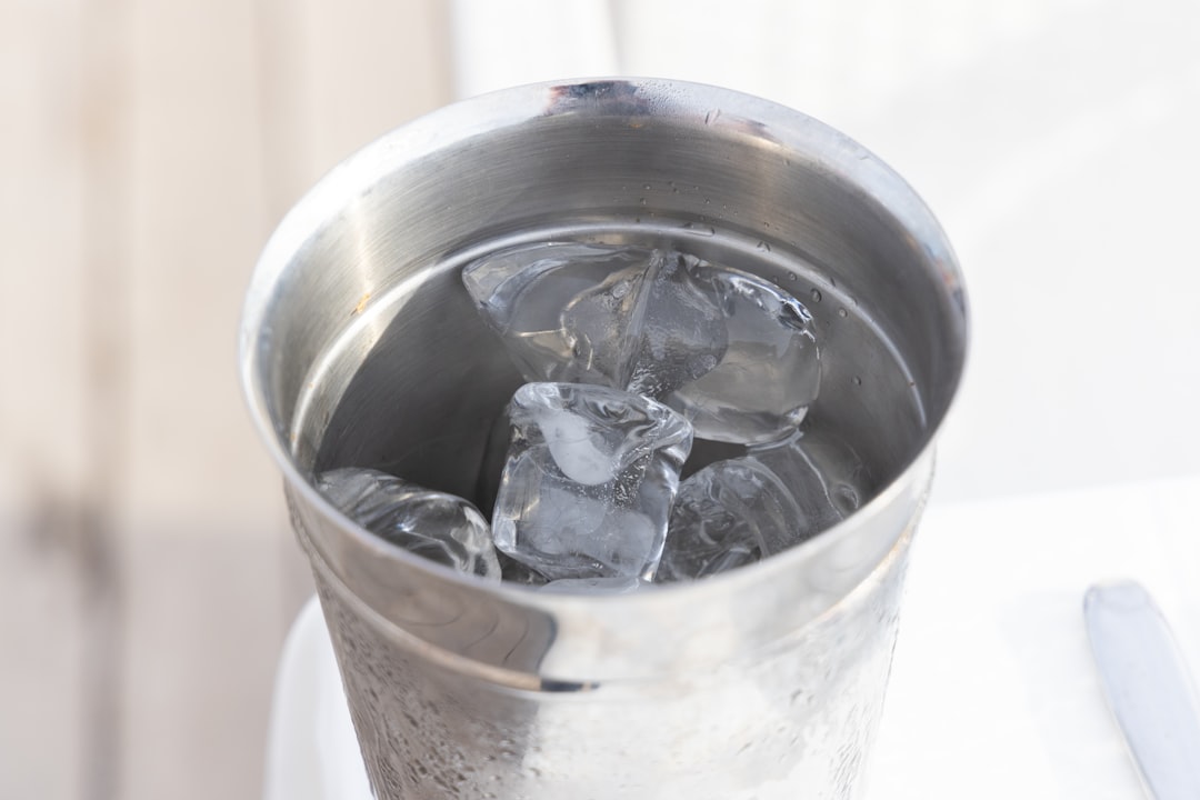 Metal bucket filled with ice cubes